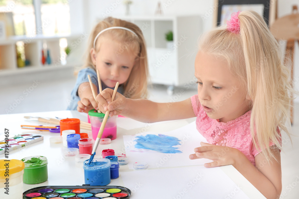 Fototapeta premium Children at painting lesson in classroom