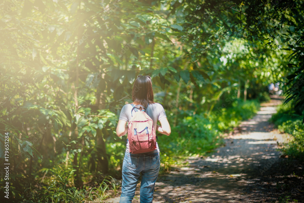 hipster woman traveler with backpack holding map at nature backgrounds park garden yard outdoors hipster woman traveler with backpack holding map at nature backgrounds park garden yard outdoors