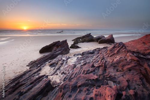 Praia da Bordeira, Algarve, Portugal. Red stone.