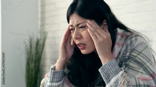 asian women extreme headache feel suffering