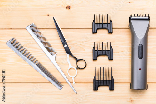 hairdresser accessories for hair cutting on a wooden background