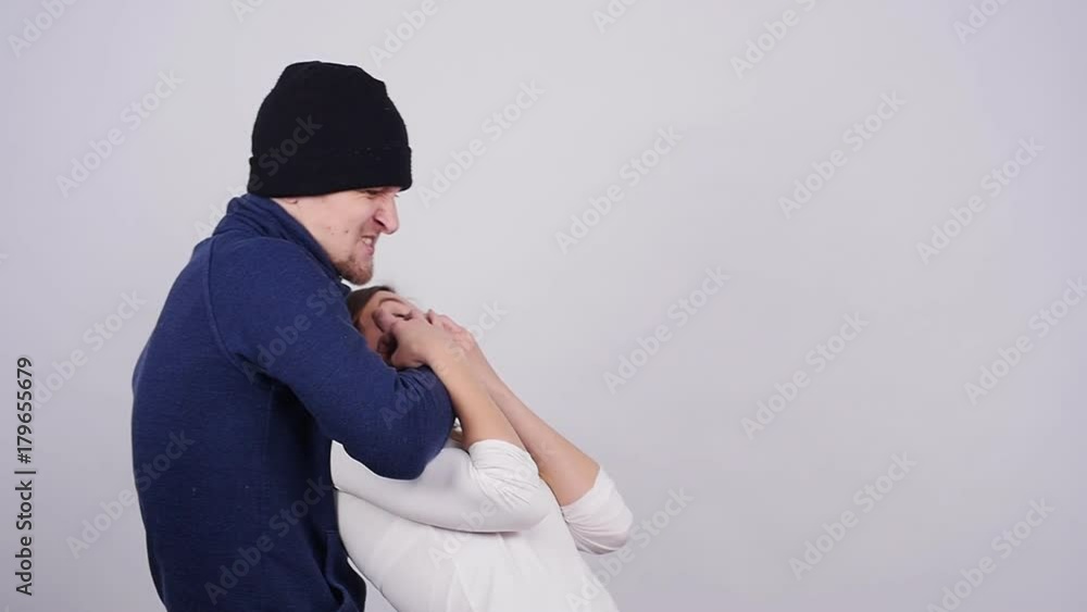 Domestic Violence. A man beats and strangles a woman Domestic Violence. A man beats and strangles a woman
