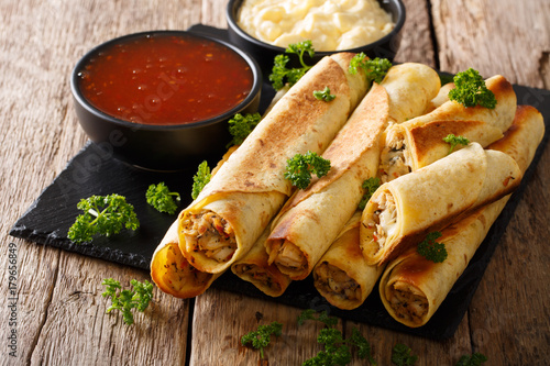 Homemade spicy chicken with chicken and two sauces close-up. horizontal photo