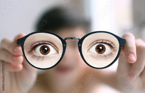 teenager kid boy in myopia eyes correction glasses close up portrait 