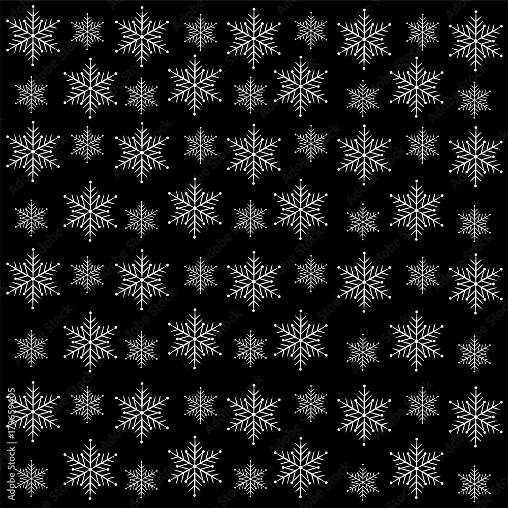White snowflakes on a black background.Christmas background.