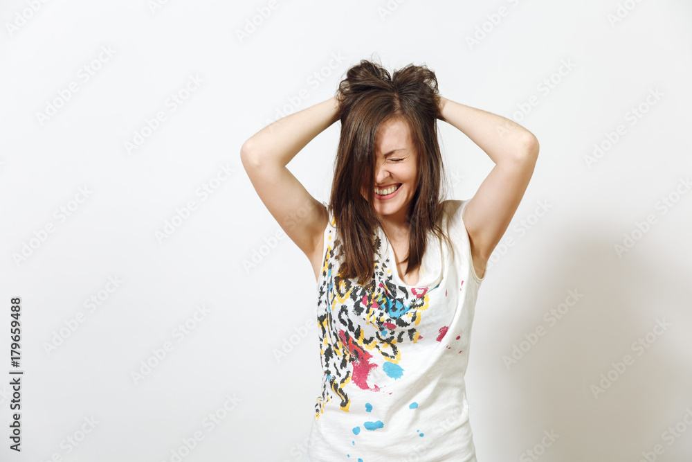 Beautiful European young funny and cheerful brown-haired woman with healthy clean skin, dressed in casual light clothes is fooling around at camera, on a white background. Emotions concept. Beautiful European young funny and cheerful brown-haired woman with healthy clean skin, dressed in casual light clothes is fooling around at camera, on a white background. Emotions concept.