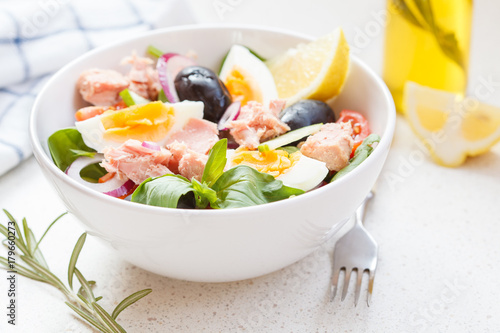 Tuna salad with egg, olives and spinach.