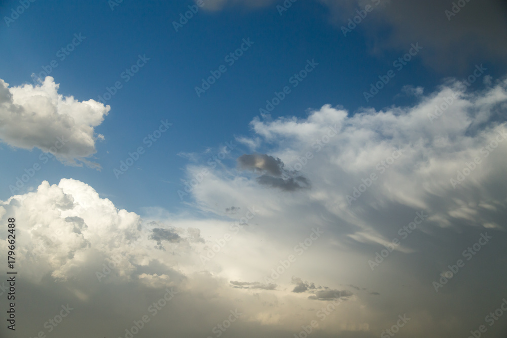 rain clouds on a blue sky as a background
