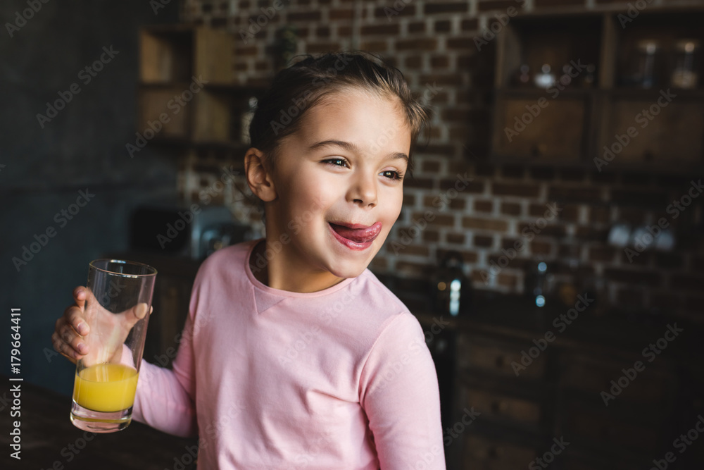 child drinking orange juice child drinking orange juice