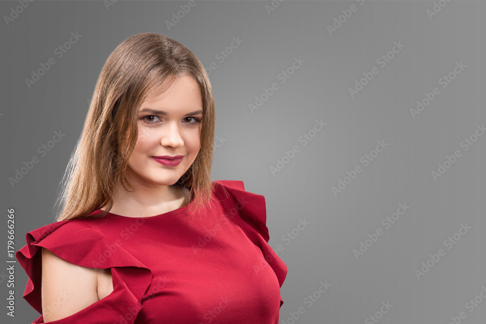 beautiful woman in red dress isolated on gray background beautiful woman in red dress isolated on gray background