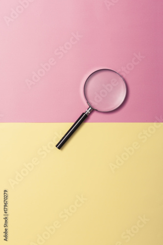 magnifier on the color paper background.