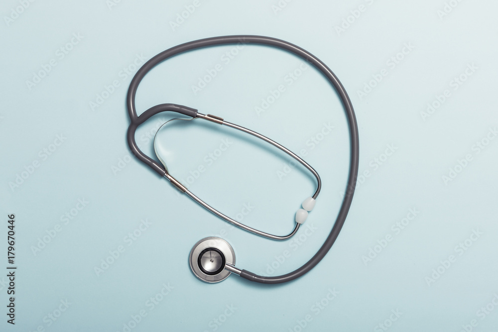 stethoscope on the color paper background. stethoscope on the color paper background.