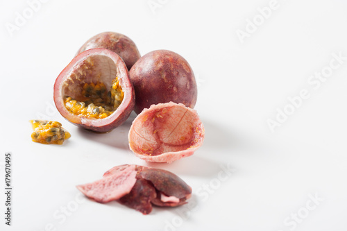 Group of passion fruits on white table