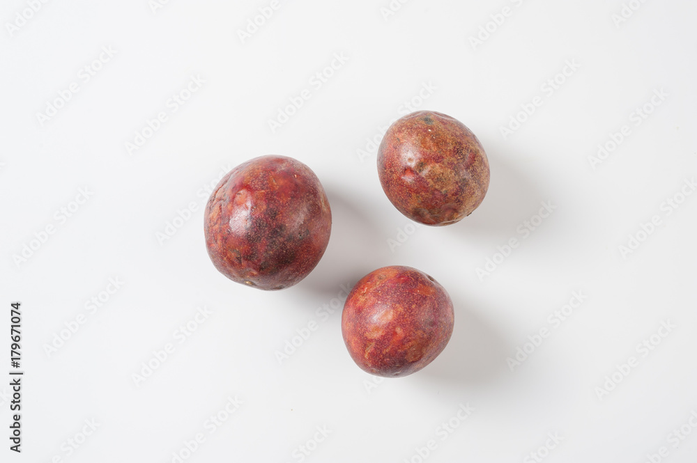 Group of passion fruits on white table