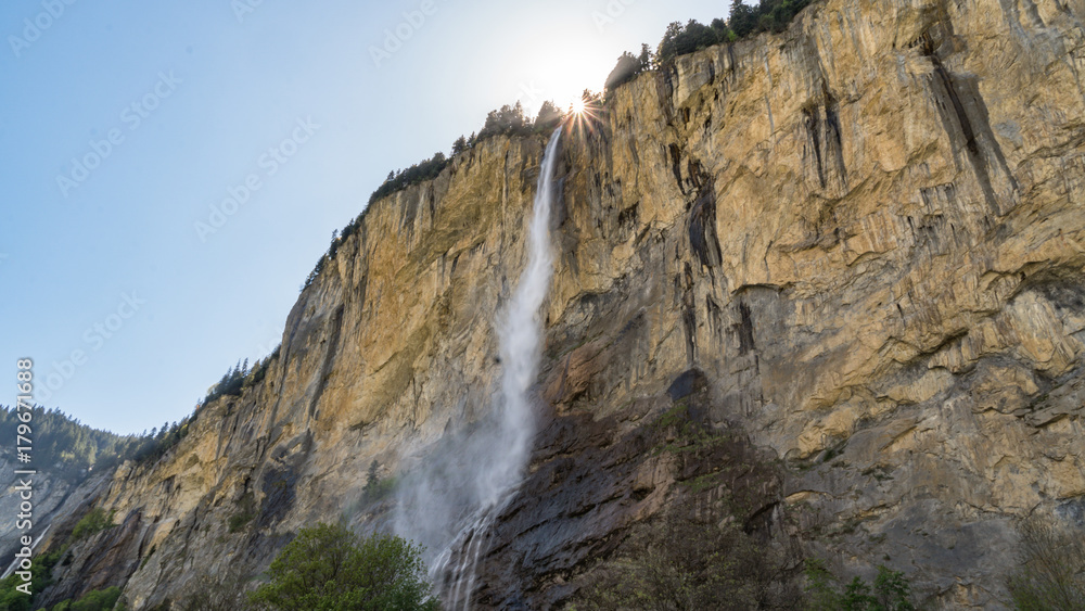 Staubbach waterfall falling from cliff in Lauterbrunnen, Switzerland.