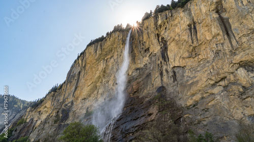 Staubbach waterfall falling from cliff in Lauterbrunnen  Switzerland.