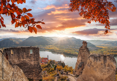 Photography DUERNSTEIN CASTLE AND VILLAGE WITH DANUBE RIVER DURING AUTUMN IN AUSTRIA