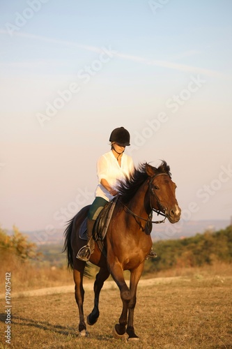 Galloping rider