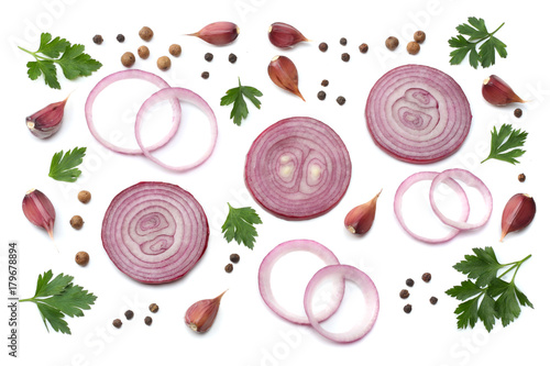 sliced red onion with parsley, garlic and spices isolated on white background top view