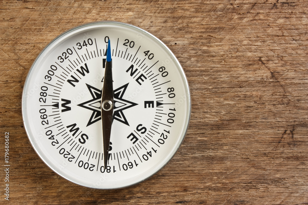 compass on wooden background compass on wooden background
