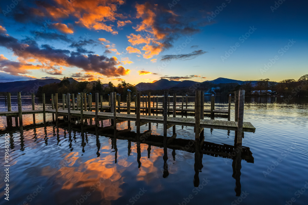 Fototapeta premium Fiery sunset at Derwentwater in The Lake District, Cumbria, England