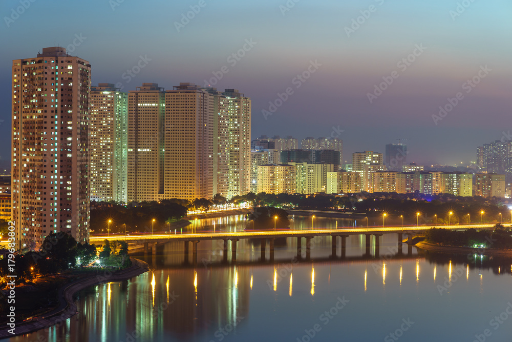Aerial skyline view of Hanoi cityscape at sunset at Linh Dam lake