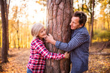 Senior couple on a walk in an autumn forest.