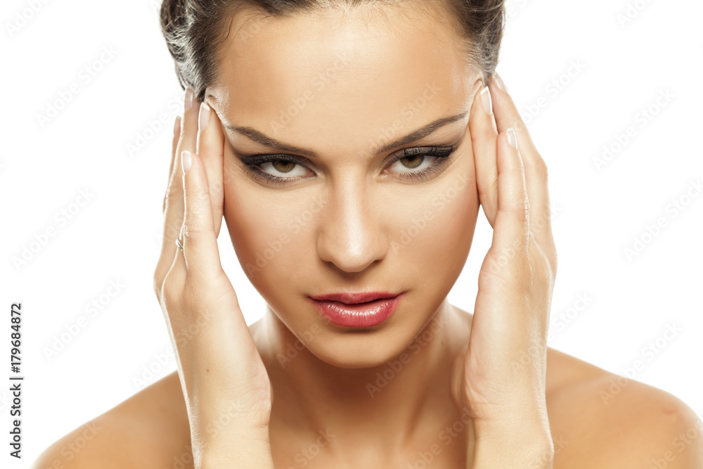 young women applied concealer under the eyes with fingers young women applied concealer under the eyes with fingers