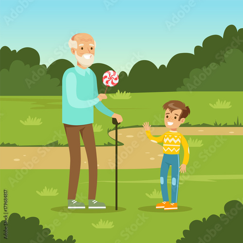 Grandfather giving sweet candy to kid