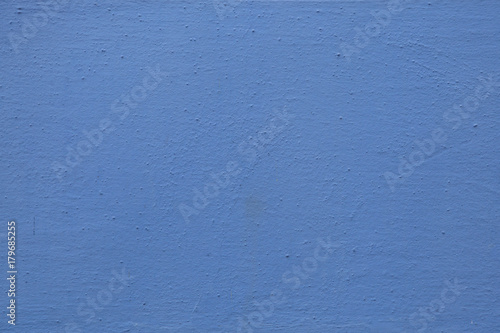 Blue painted stucco wall. Background texture