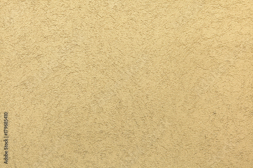 Wallpaper Mural Yellow painted stucco wall. Background texture Torontodigital.ca