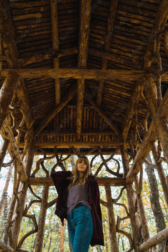 Model posing in wooden passage Model posing in wooden passage
