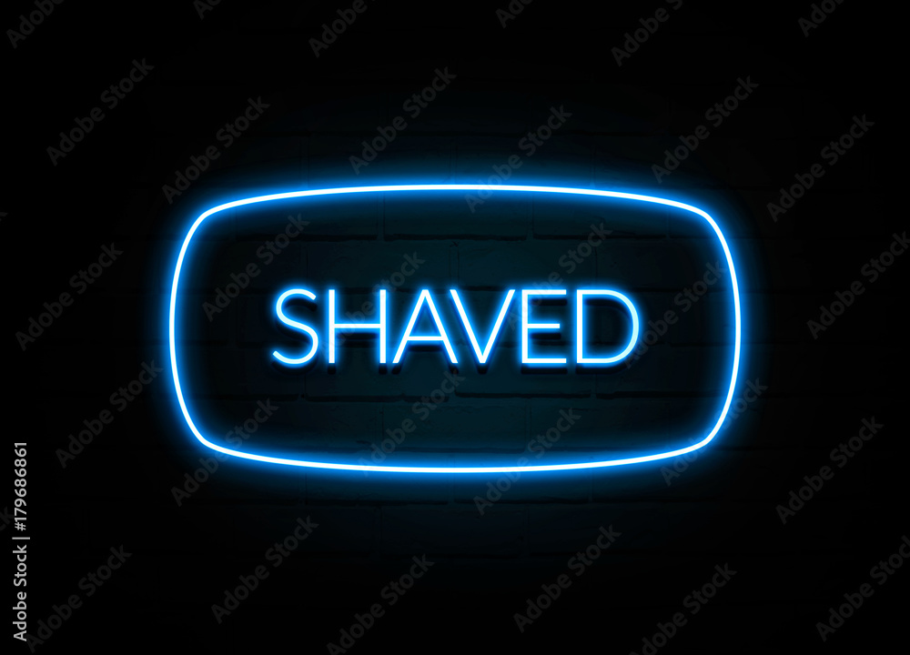 Shaved  - colorful Neon Sign on brickwall