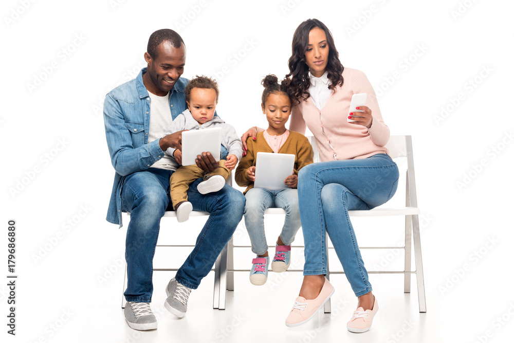 african american family using devices