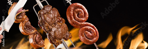 Picanha, sausage and ancho traditional Brazilian barbecue. photo