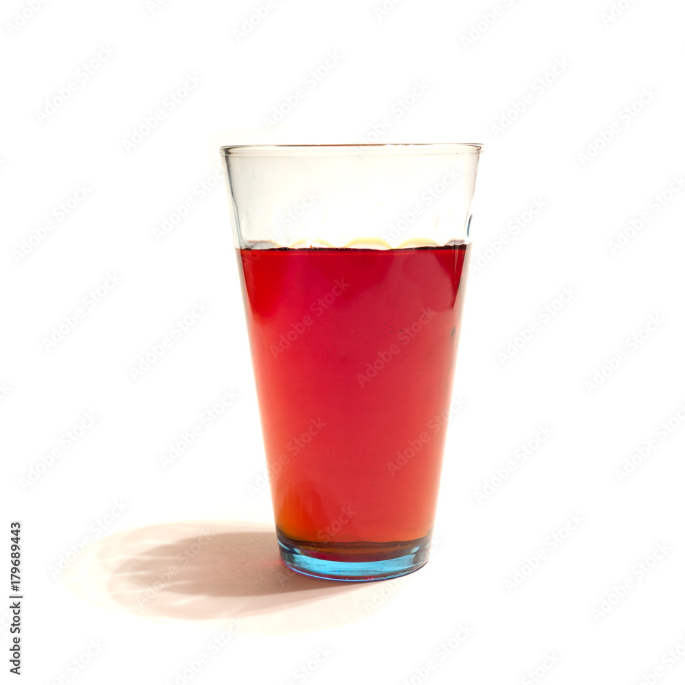 red juice in a glass on a white background, isolate red juice in a glass on a white background, isolate