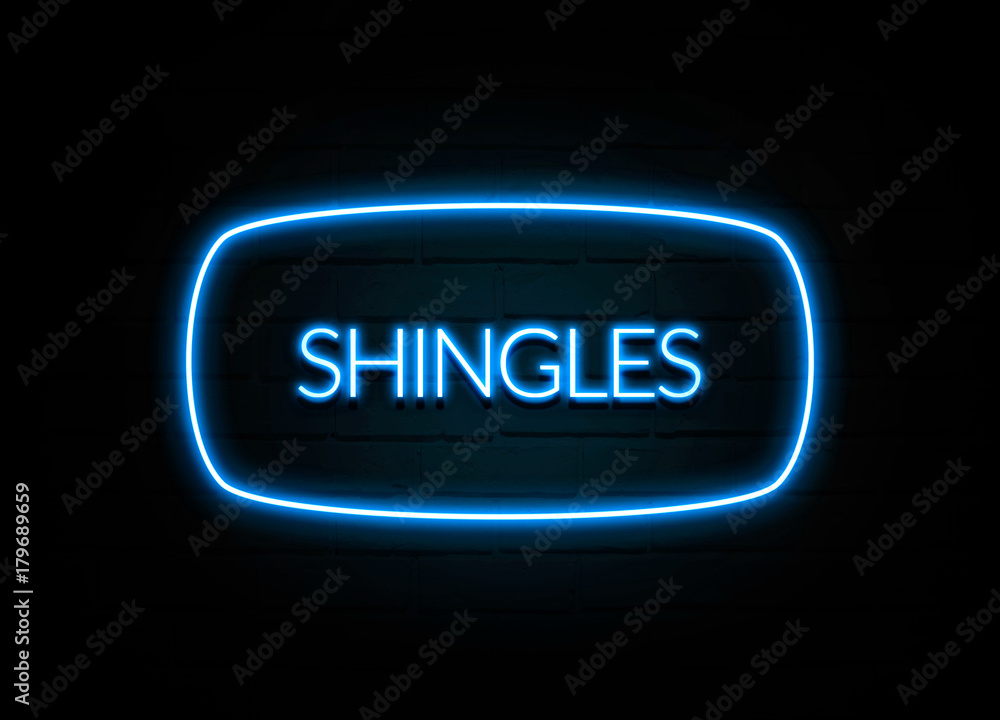 Shingles - colorful Neon Sign on brickwall Shingles - colorful Neon Sign on brickwall