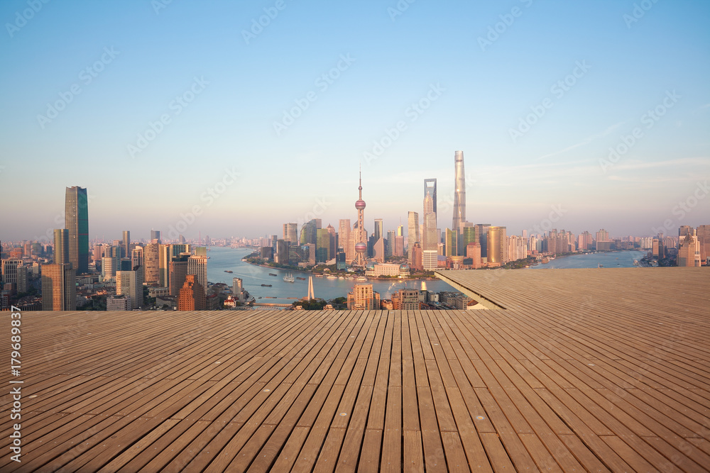 Empty wood floor with city landmark buildings of Shanghai Skyline