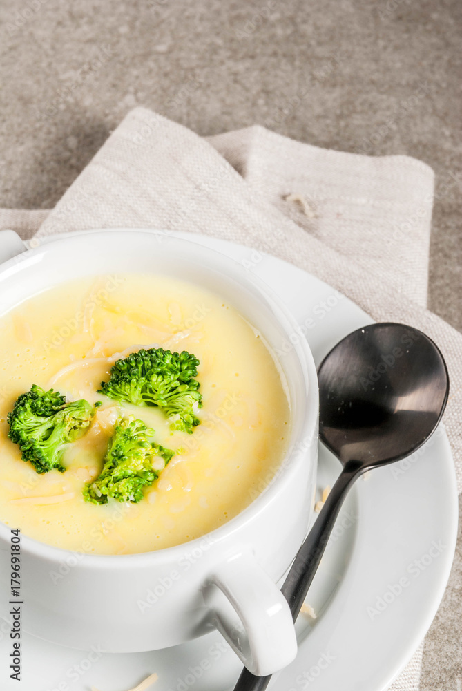 Broccoli, cheese and chicken soup, on gray stone table, copy space Broccoli, cheese and chicken soup, on gray stone table, copy space