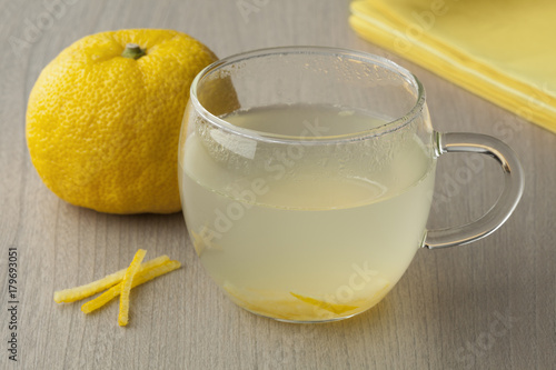 Cup with fresh Japanese Yuzu tea photo