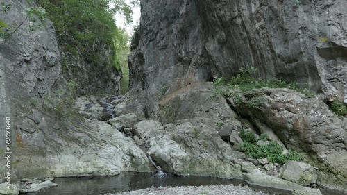 Natural water spring cascades close-up footage - Stone bridge in Eastern Serbia photo