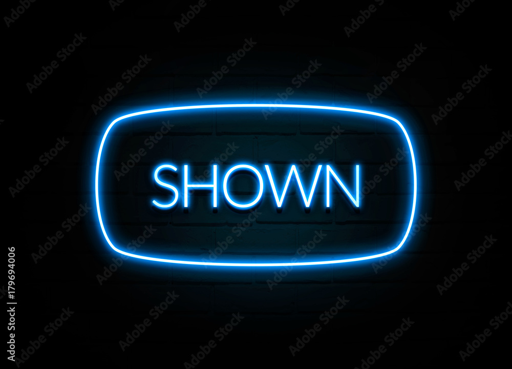 Shown - colorful Neon Sign on brickwall Shown - colorful Neon Sign on brickwall