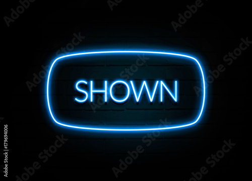 Shown - colorful Neon Sign on brickwall