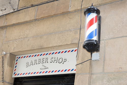 Beautiful Barber Shop facade Symbol of a barbershop Lamp photo