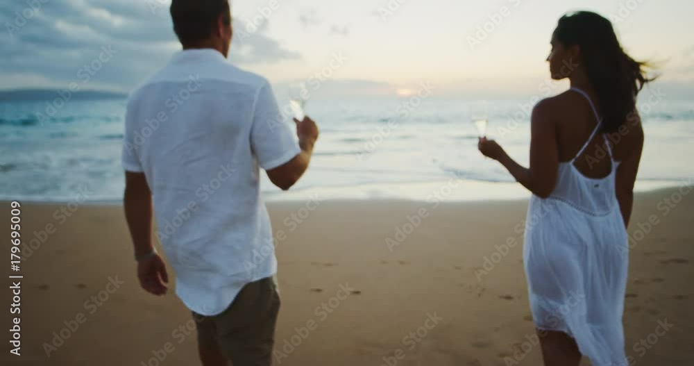 Couple Drinking Champagne at Sunset Couple Drinking Champagne at Sunset