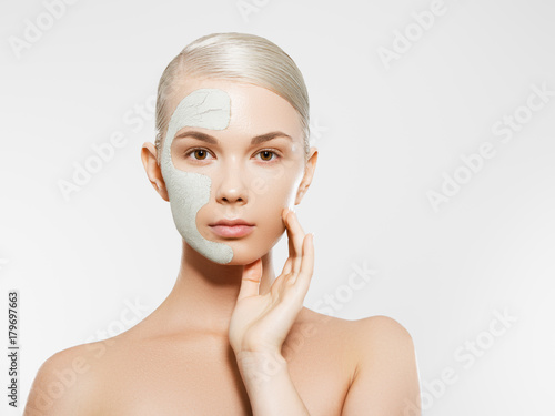 Skin And Body Care. Closeup Of Beautiful Sexy Woman With Cosmetic Clay Mask On Skin. Portrait Of Healthy Young Female With Fresh Natural Makeup. Spa Cosmetics