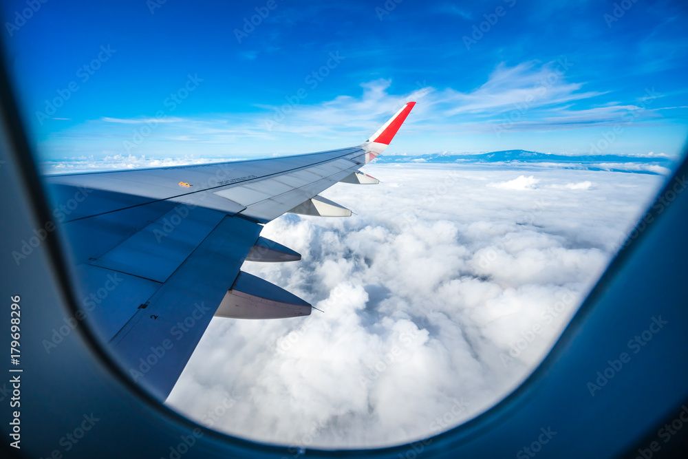 Fototapeta premium The plane on the clouds