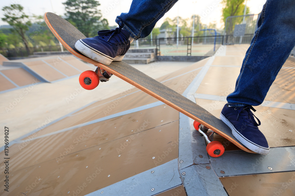 skateboarder legs skateboarding on skatepark ramp skateboarder legs skateboarding on skatepark ramp