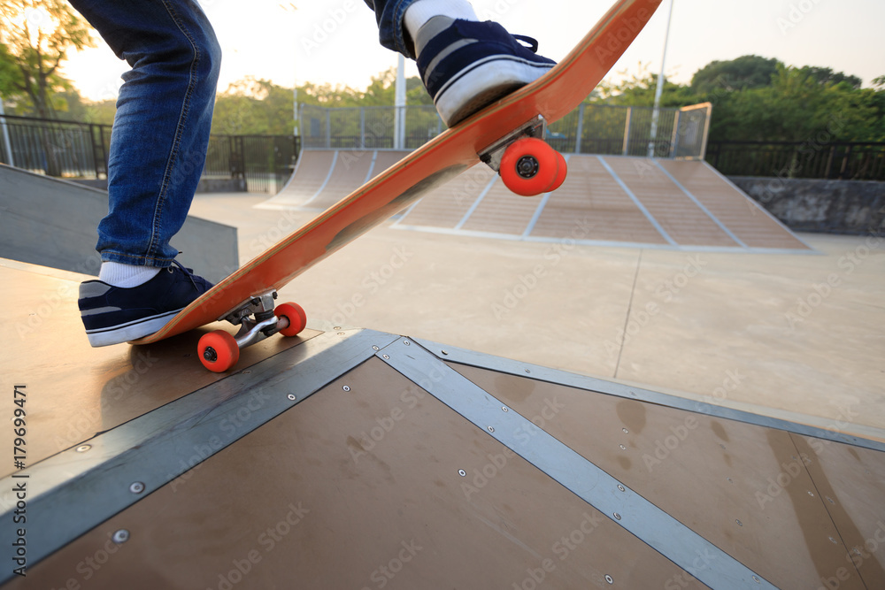 skateboarder legs skateboarding on skatepark ramp skateboarder legs skateboarding on skatepark ramp