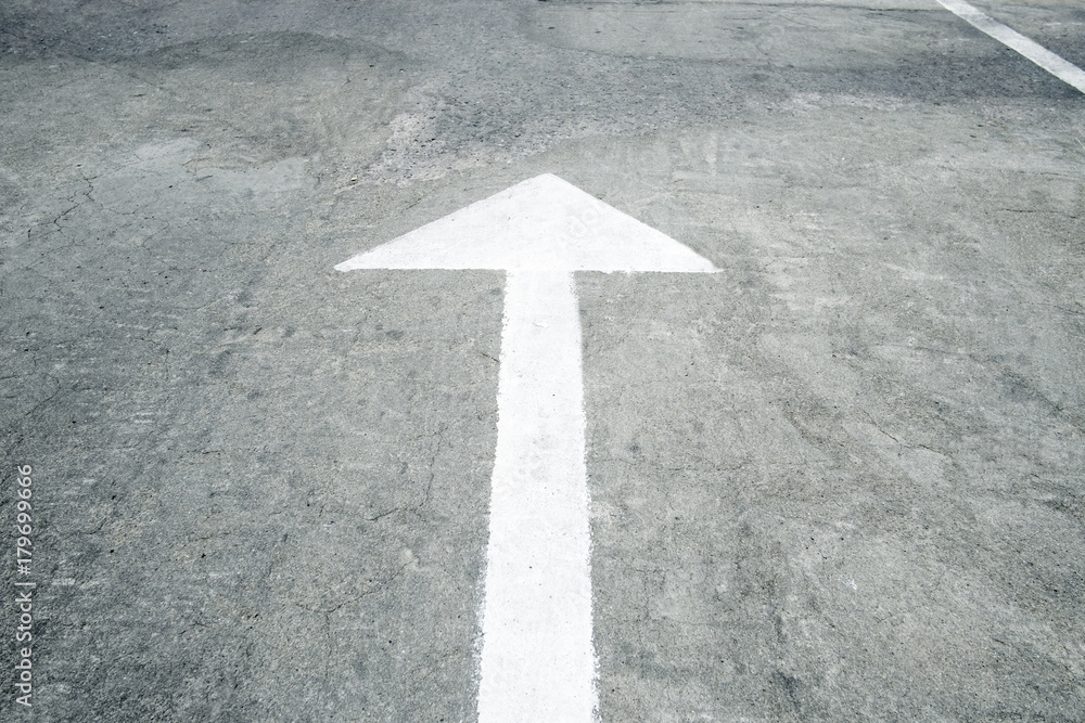 Arrow on the road and white color Arrow on the road and white color